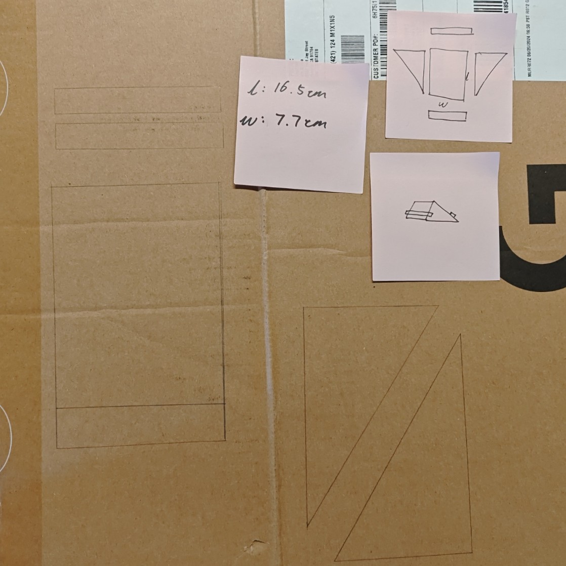 I first measured out the size of my phone. I also drew out the pieces I would need and the final product to make sure I would not forget anything. Then I drew down what I need to cut down on the cardboard.